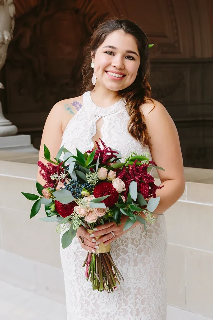 Bride holding jewel tone bridal bouquet