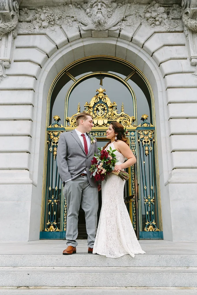 Bride and groom in front of City Hall