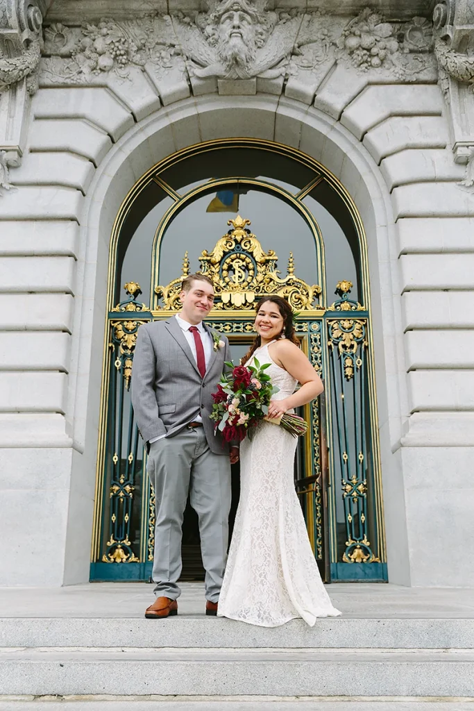 Married couple smile at front door