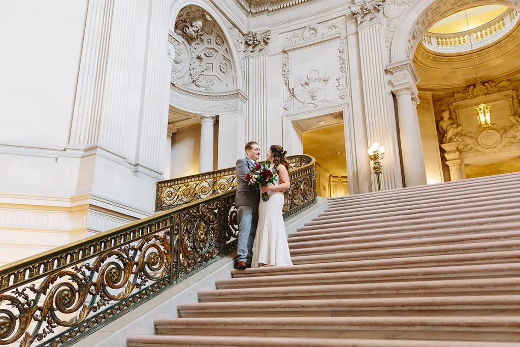 Bride and groom walk down Grand Staircase