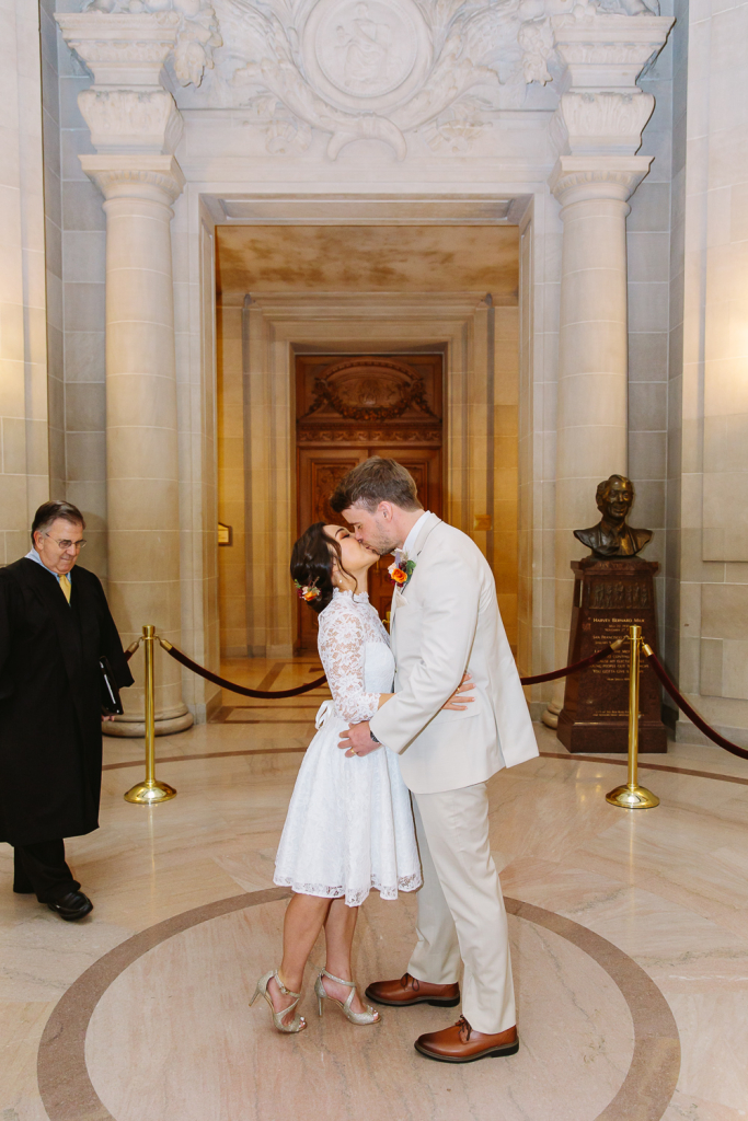 Couple kiss at the end of their wedding ceremony