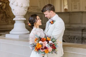Couple smile at each other at their City Hall SF wedding