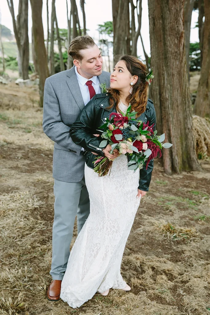Groom holds bride