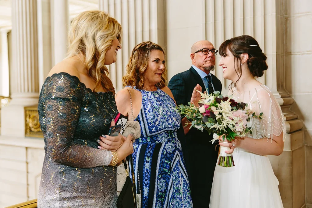 Family members chat with bride before ceremony