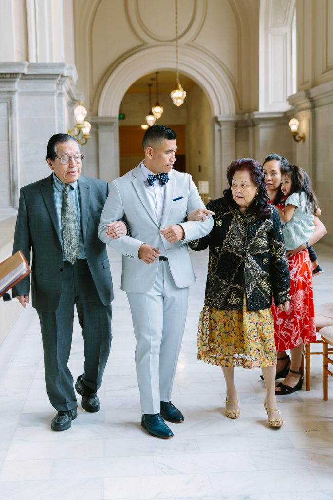 Groom walking down the aisle at his San Francisco City Hall wedding