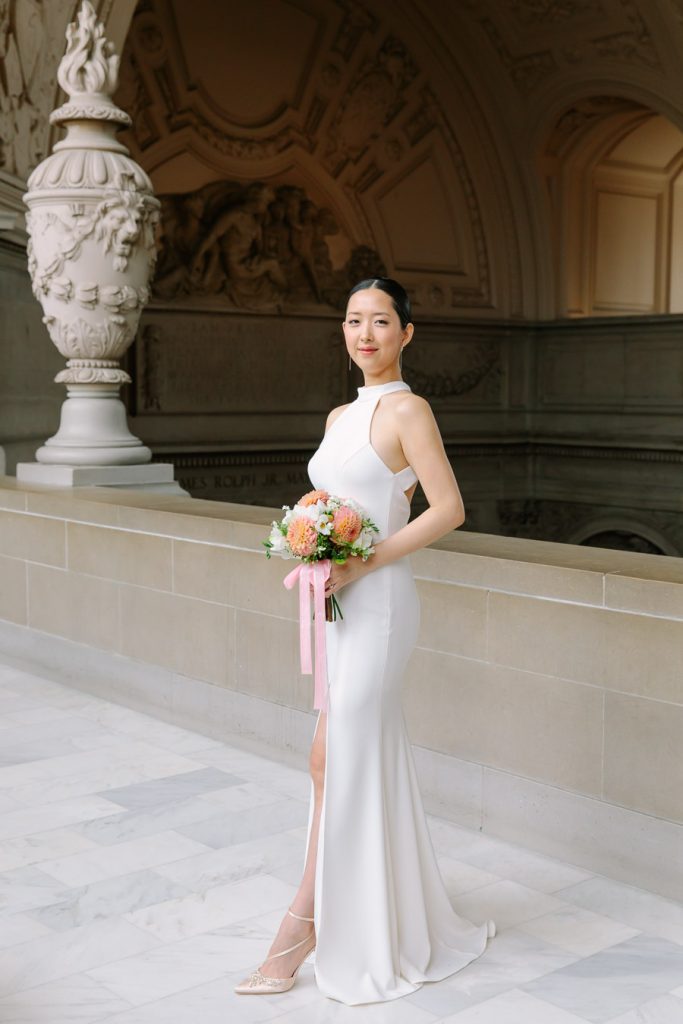 Full length photo of bride holding her bouquet