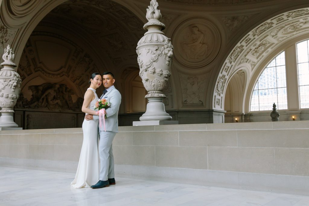 Bride and groom holding each other on the Fourth Floor at Wedding Ceremony on the Fourth Floor at San Francisco City Hall