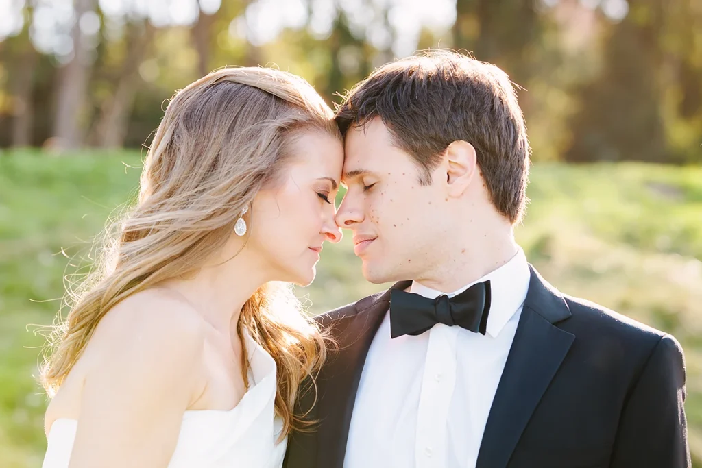 Bride and groom touch foreheads together
