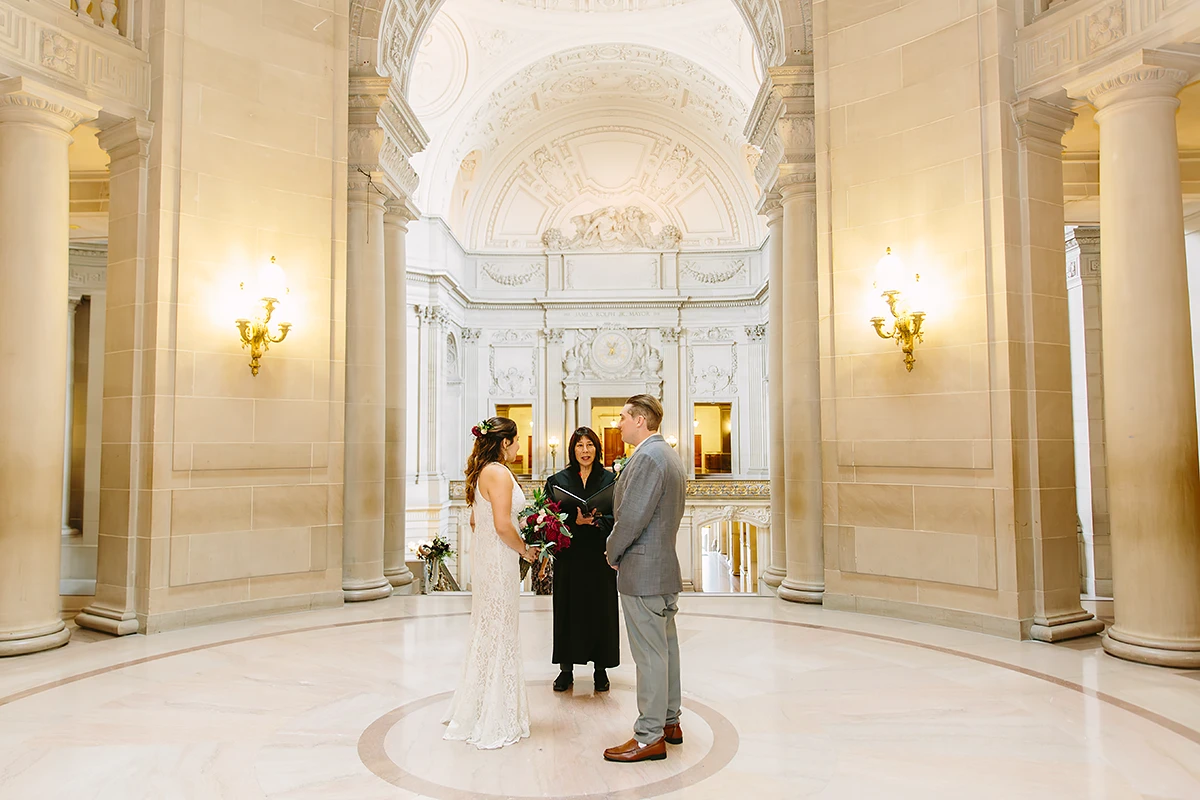Bride and groom at their SF City Hall elopement ceremony in the rotunda