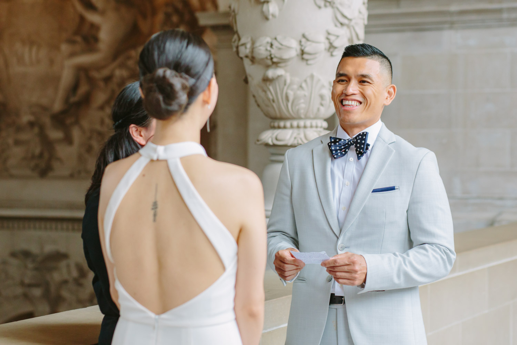 Groom exchanges vows with his bride