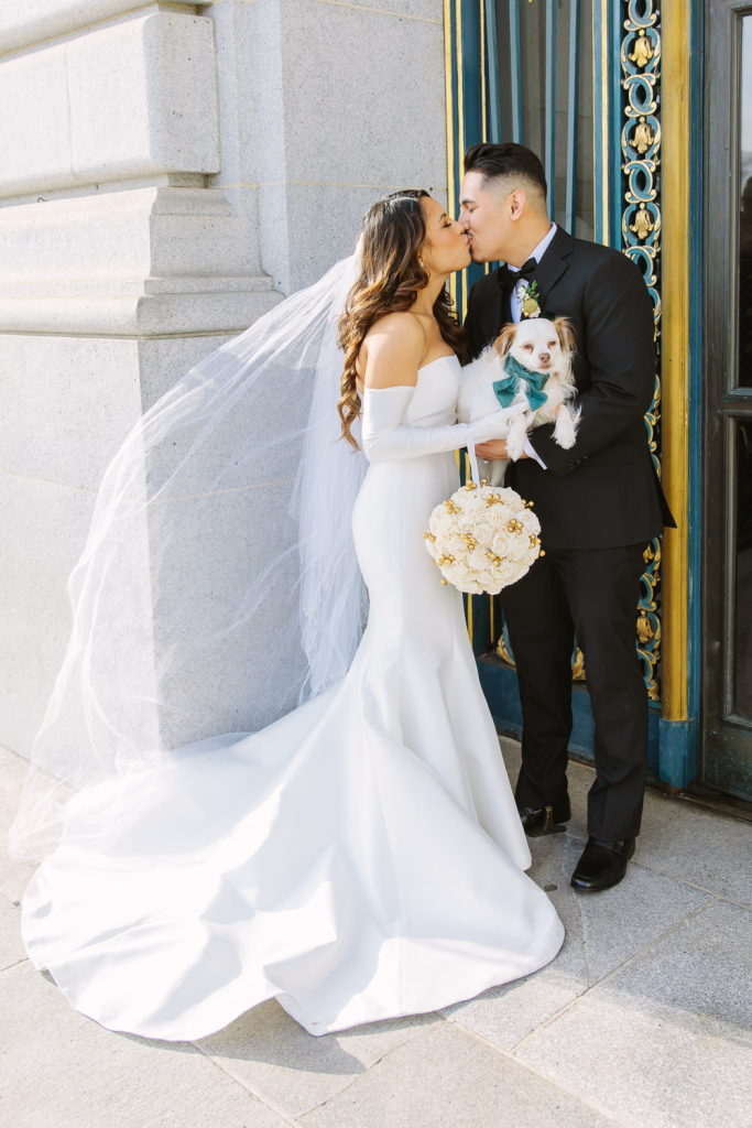 Bride and groom kiss at their San Francisco City Hall wedding