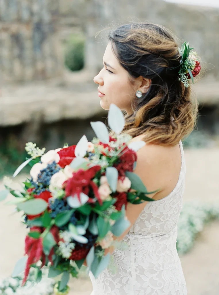 Bride holding her bouquet as she looks away