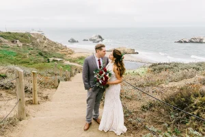 Bride and groom hold each other at their Sutro Baths wedding in San Francisco