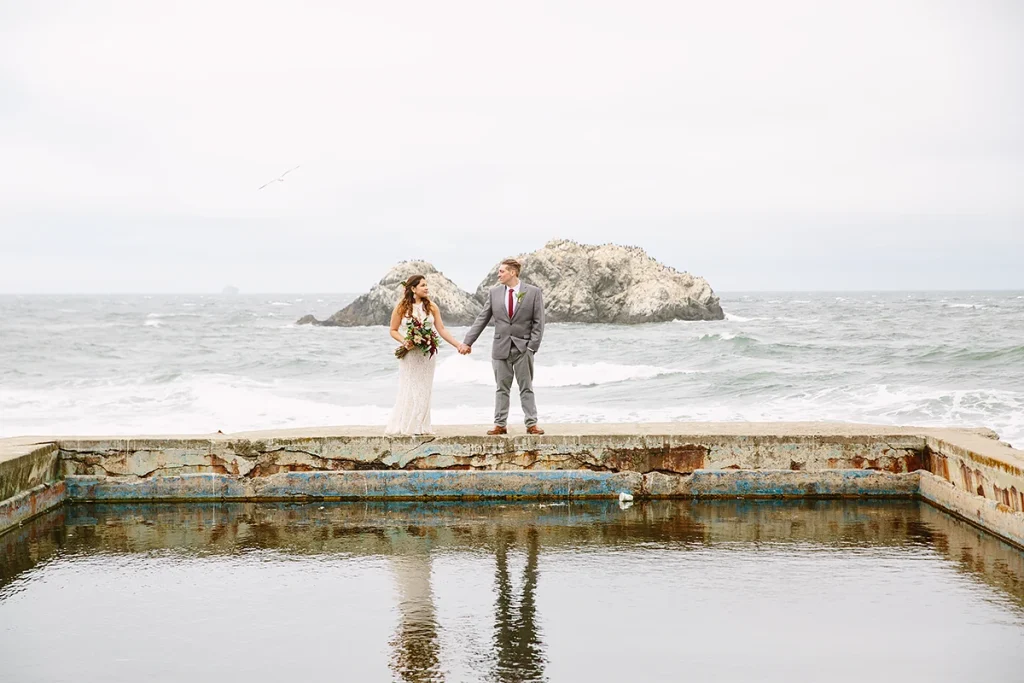 Couple walk together at Sutro Baths